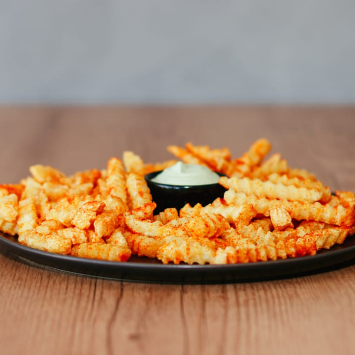 Batata frita crocante, temperada com Tempero especial, uma combinação irresistível para os amantes de batata. 400 Gramas