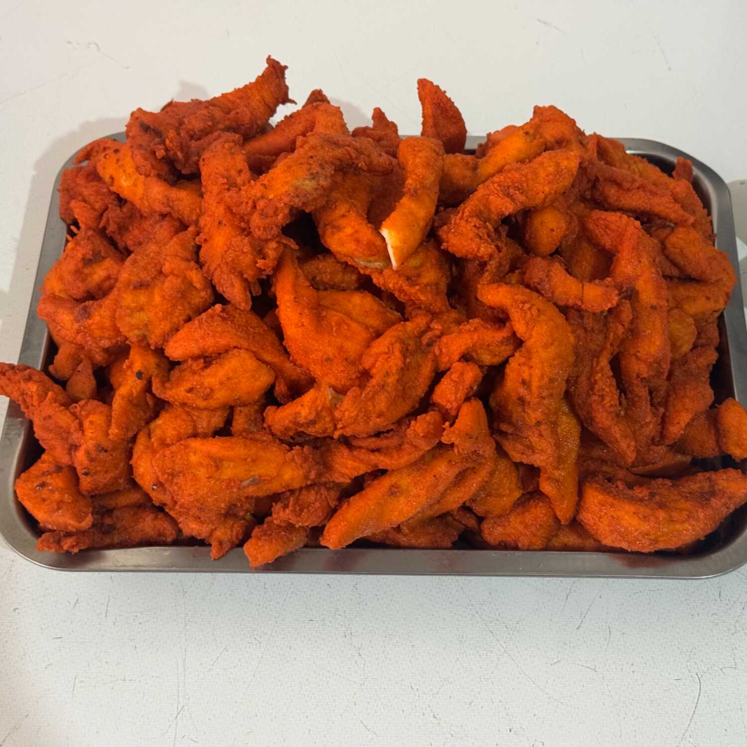 1 Kg. de Tiras de Pechuga de Pollo Empanizada