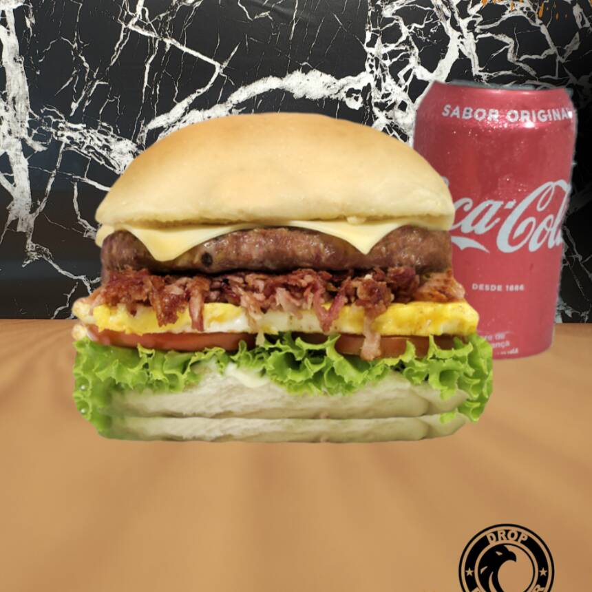 Coca lata 150ml pão com gergelim, molho grill, carne , mussarela bacon ovo alface e tomate