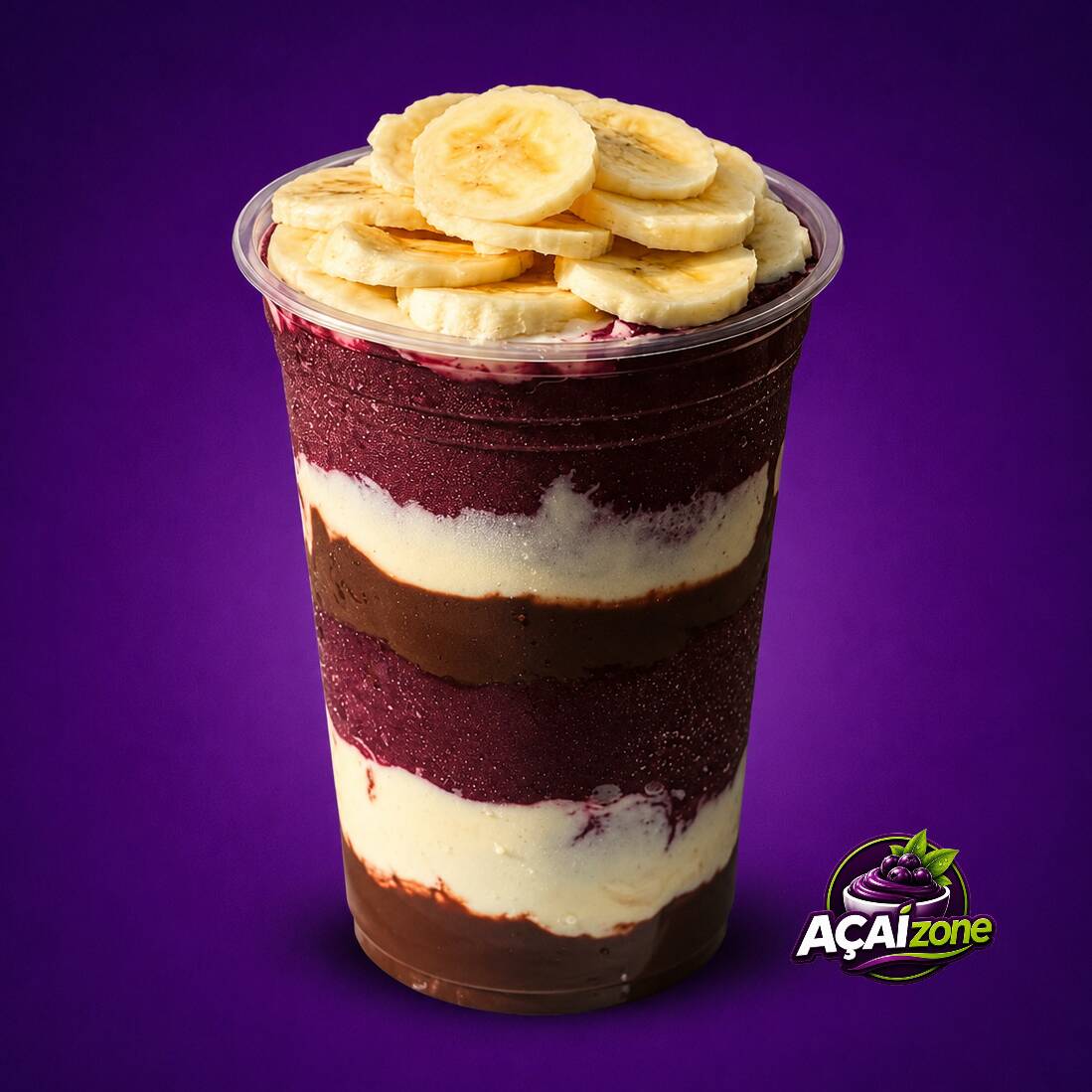 Açaí tradicional com creme de leitinho, creme de avelã e banana.
