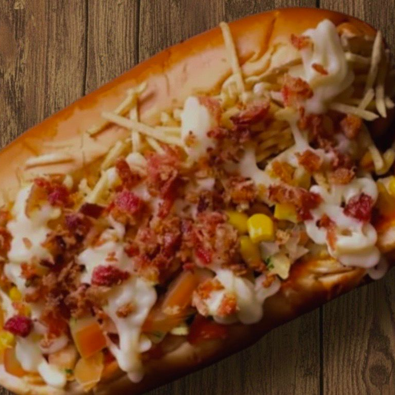 1 Cachorro (Pão, 2 Salsicha ou 2 Linguiça, Milho, Ervilha, Azeitona, Tomate, Cebola, Presunto, Cheddar, Catupiry, Passas, Ketchup, maionese de alho e Batata Palha