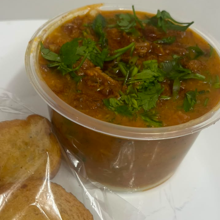 Costela desfiada com aipim batido e queijo por baixo