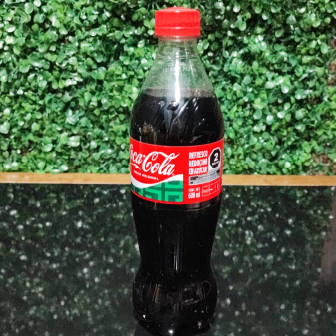 Coca cola regular 600 ml.