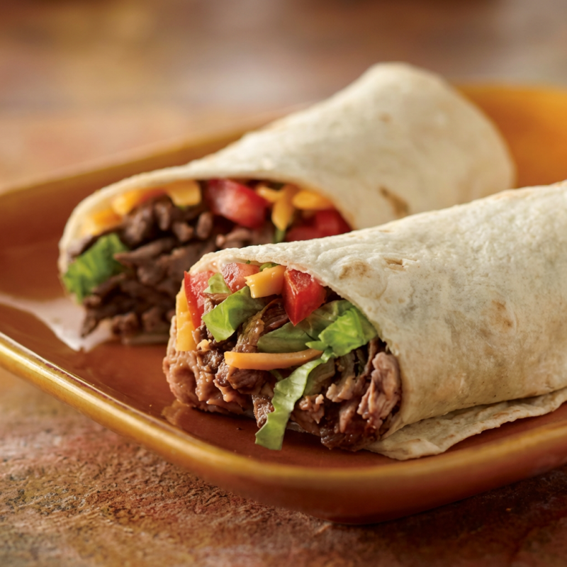"***Atenção: Na Confecção Vai Calabresa E Pvt*** Tortilla recheada com calabresa vegetal, chilli a base de carne vegetal e feijão vermelho, cebola roxa, alface, tomate e sour cream. Sem pimenta. Para adicionar pimentas, selecione no campo complementos. Para pedir molhos ou pimentas a parte, selecione também o item ""embalagem extra""."Atenção: NÃO TEM COMO RETIRAR COENTRO, CEBOLA E ALHO Peso médio:190g