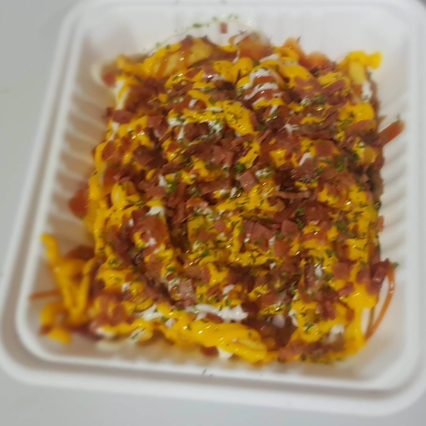 Papas con Tocineta + Te Frio