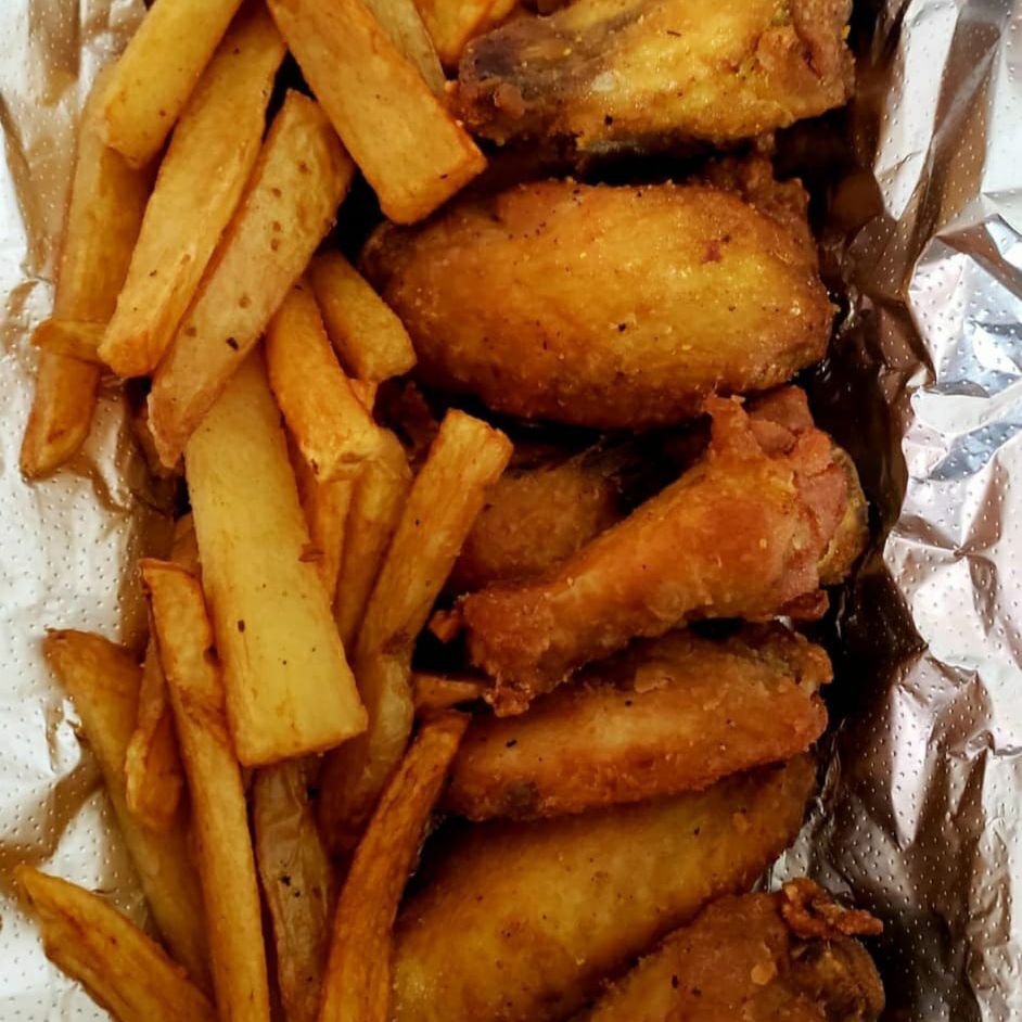 Alitas lemon pepper 8 pzas/100grs de papas.