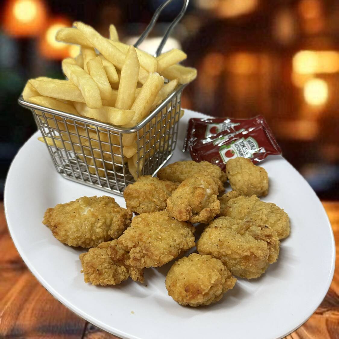 Nuggets de pollo con papas