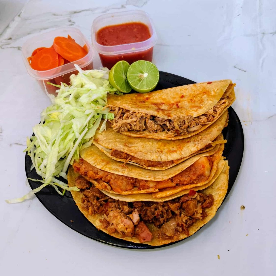 4 tacos surtidos carne, fríjol, chicharrón y papa