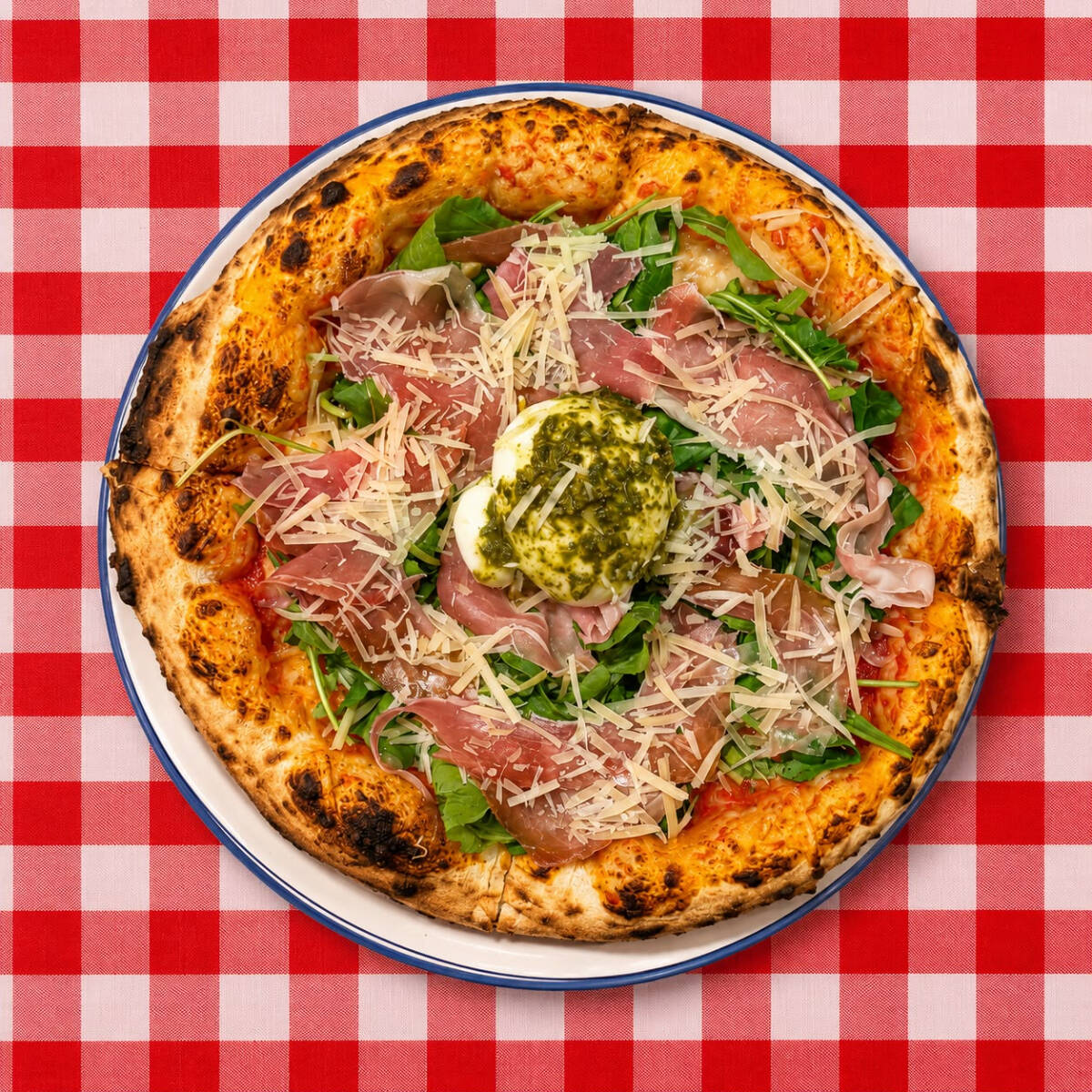 Pizza de 30cm. Molho pomodori, mozzarella, rúcola, presunto parma, parmesão, manjericão e burrata