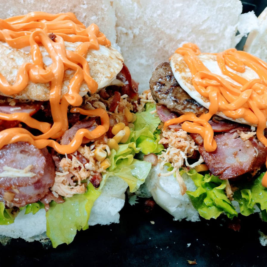 Pão, 1 hambúrguer de 90g, Queijo, Presunto, Maionese, Alface, Tomate E Milho, Ovo, Frango, Bacon, Calabresa E Opção De Catupiry Ou Cheddar