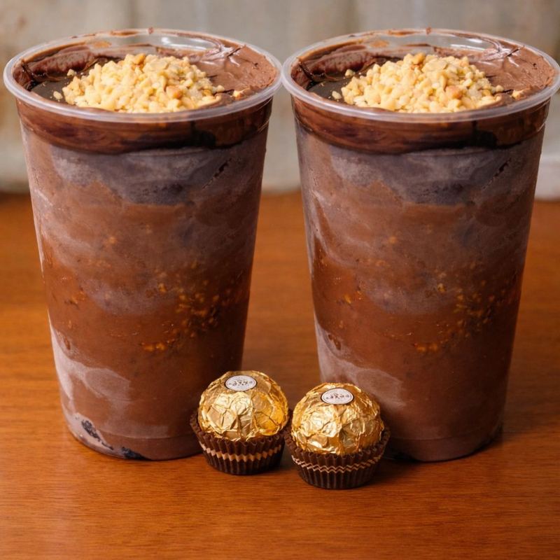 Açaí cremoso em 2 copos de 500ml com muita Nutella, amendoim crocante e de brinde um 2 Bombons da Ferrero Rocher!