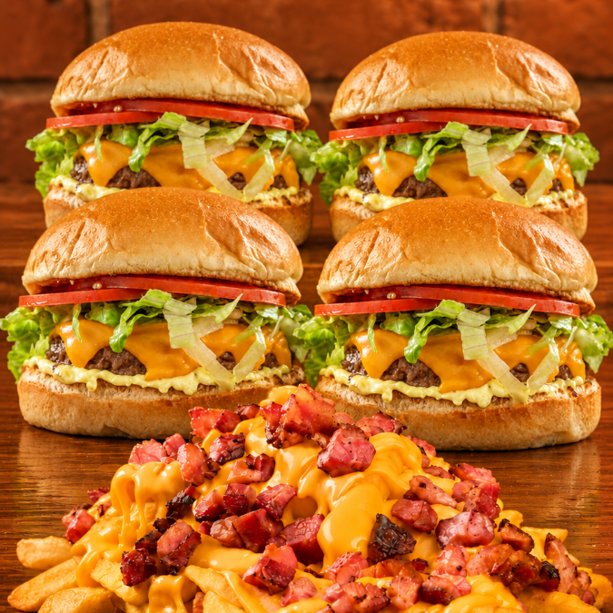 4 Gourmet Samuka Simples (pão gourmet, burguer artesanal 60g, salada, molho Samuka e cheddar), acompanhados de fritas com queijo, cheddar e bacon(500g). Uma combinação para reunir a família!