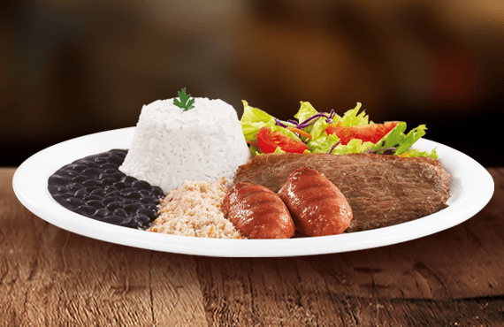 Aquele sabor de churrasco inconfundível. Bife bovino grelhado (aprox. 85g in natura) e linguiça toscana dourada (aprox. 60g in natura). Acompanha arroz, feijão, farofa crocante, salada e molho.
