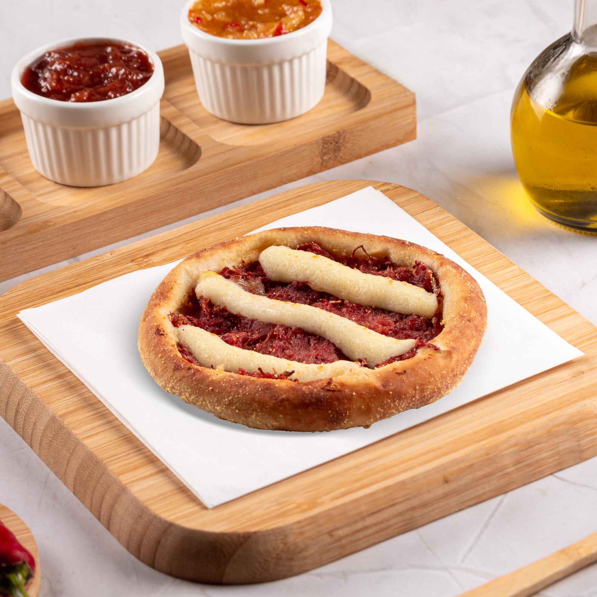 Recheada com carne seca desfiada e Catupiry Original, uma explosão de sabor cremosa e deliciosa.