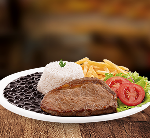 Experiência premium! 150g (aproximadamente e in natura)de Bife Ancho (corte nobre da costela), macio e muito saboroso. Escolha o ponto da carne! Acompanha arroz, feijão, salada fresca, fritas e molho.