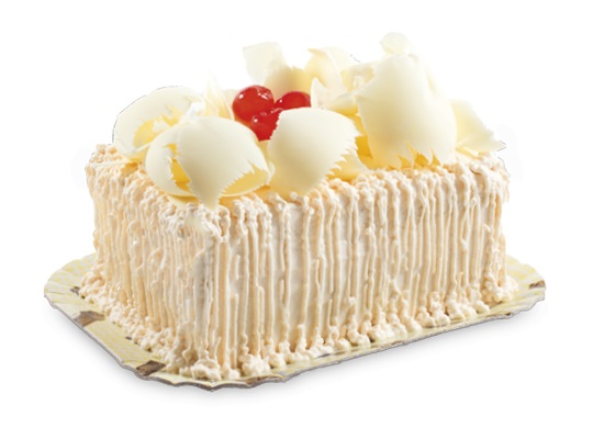 Bolo branco, recheio de creme de chocolate branco aerado e trufas brancas, cobertura de mousse branca, raspas de chocolate branco e cerejas (decorativas).