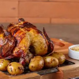 Frango assado + batata assada + farofa da casa