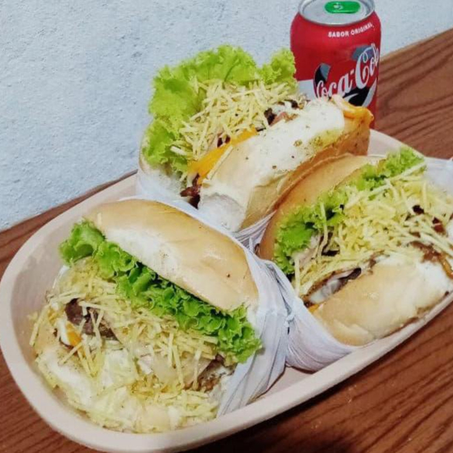 Pão de hambúrguer, 2 carnes, 2x calabresa, bacon, ovo, queijo mussarela, presunto, salada.