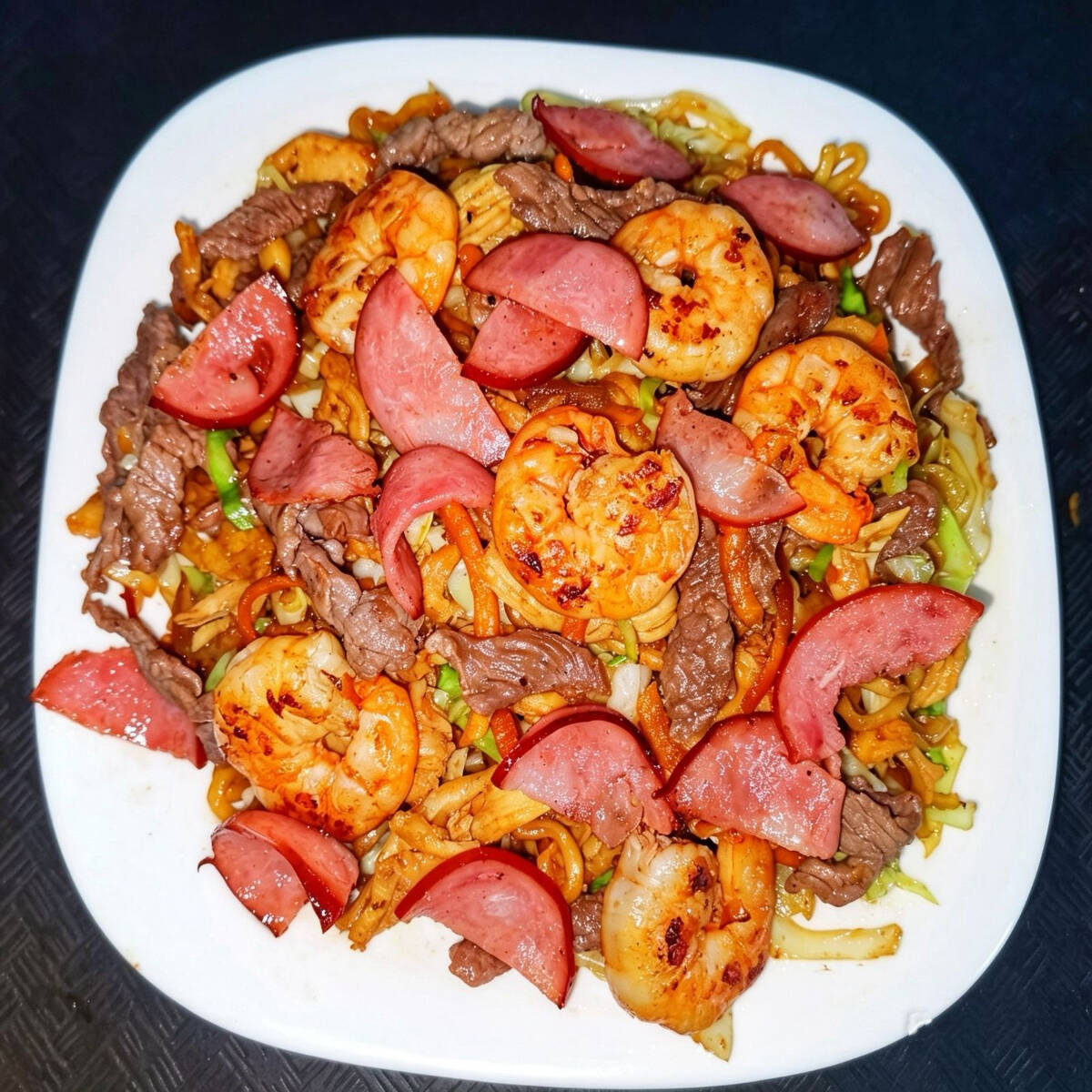 Macarrão, Camarão, Frango, Calabresa, Carne, Cebola, Cenoura, Repolho ,Alho picado, Molho de soja