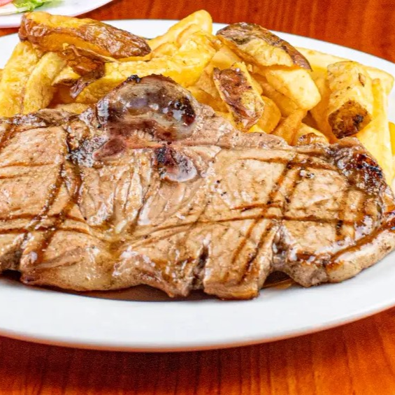 Chuleta A La Parrilla Jr + Bebida Del Día