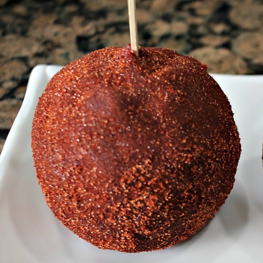 Manzana con Palillo.