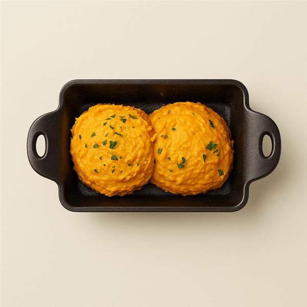 Acompanhamento de purê de abóbora cabotiá. Porção individual.