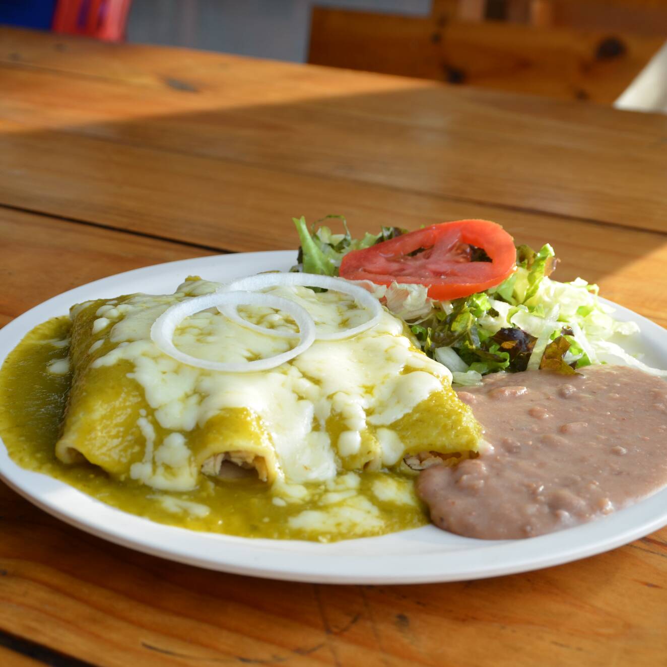Enchiladas Suizas con Frijoles.