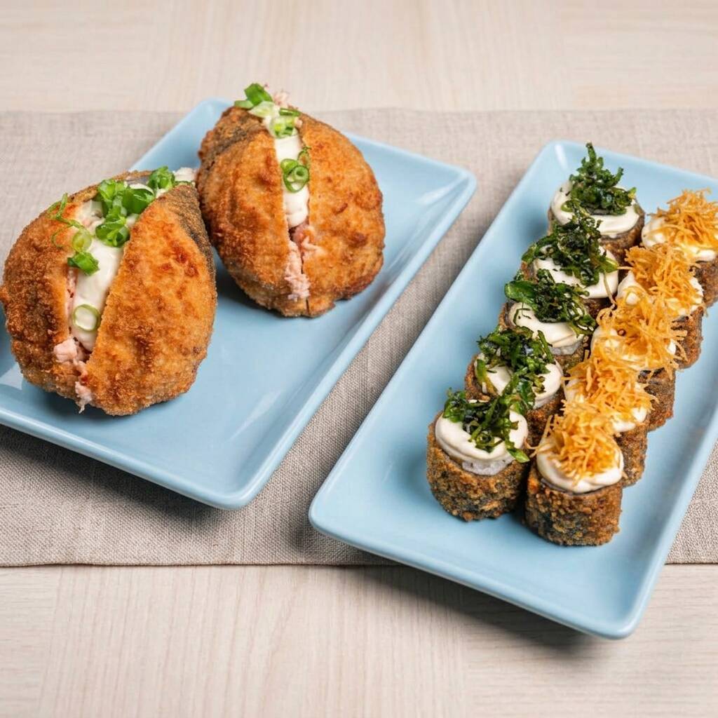 6 hot rolls com couve crispy, 6 hot rolls com batata crispy acompanhado de 2 temakis de salmão empanado. Acompanha 2 hashis, 2 saches de molho shoyo e 2 saches de tarê.