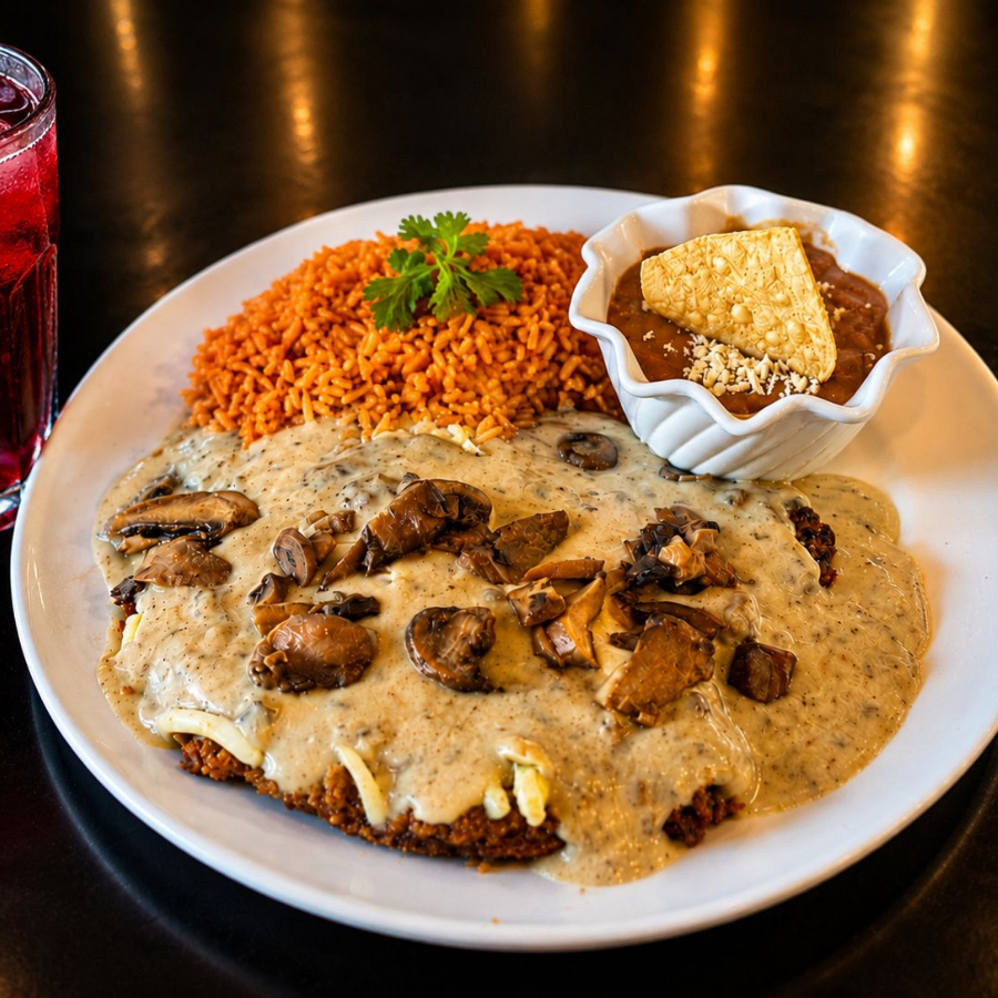 Milanesa empanizada con queso y crema de champiñon