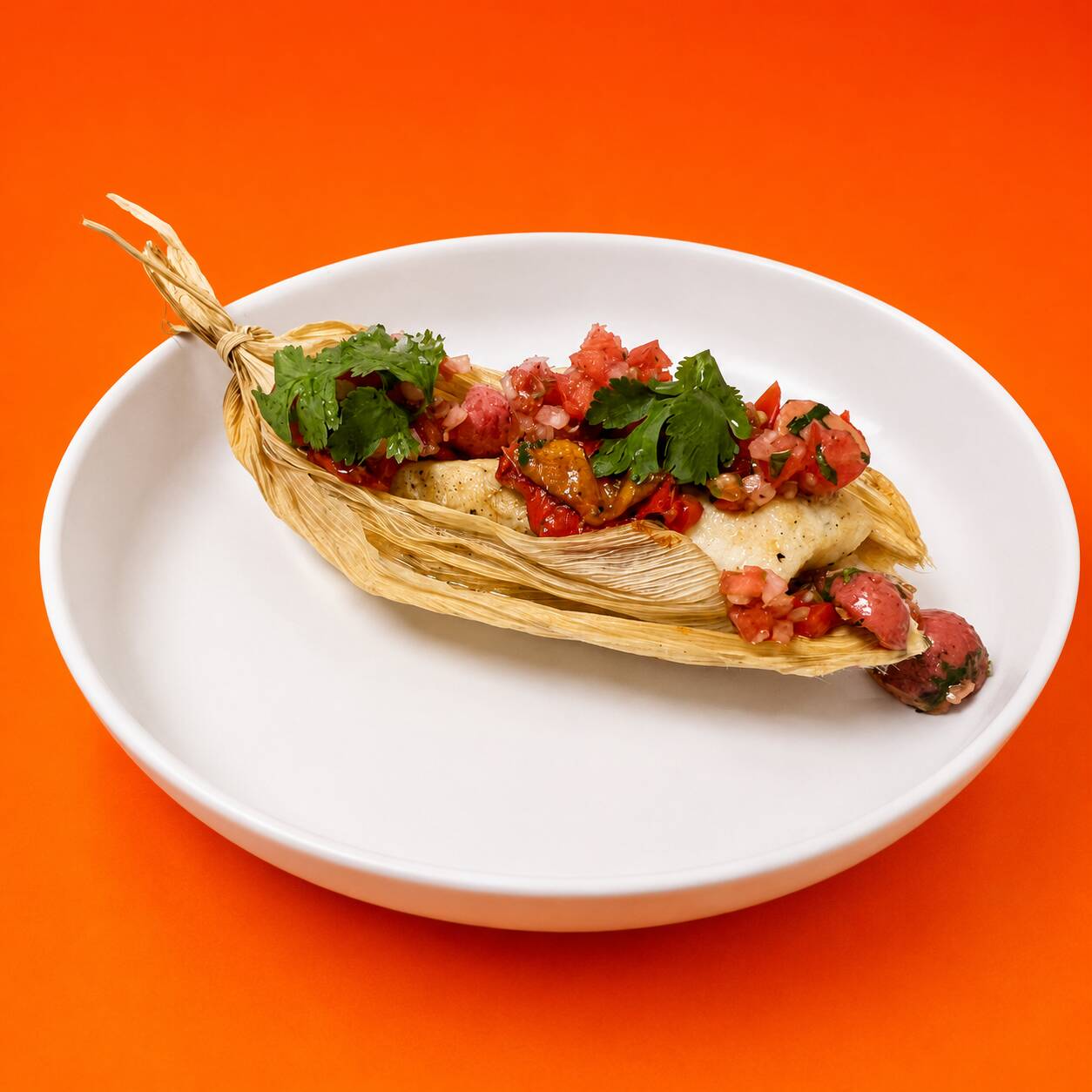 Tilapia al Ajillo en Hoja de Maíz