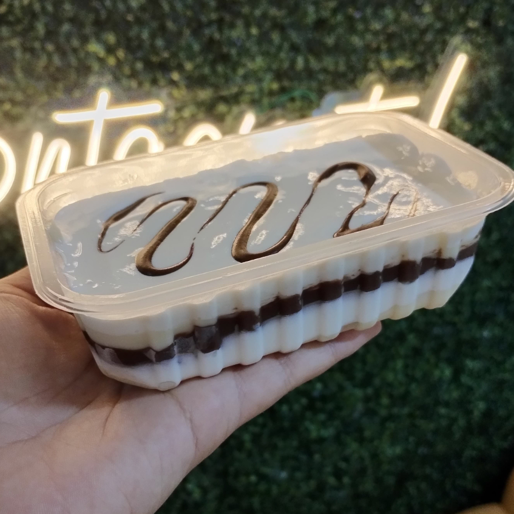 Creme de ninho e nutella intercalado com biscoito. Peso 200g.