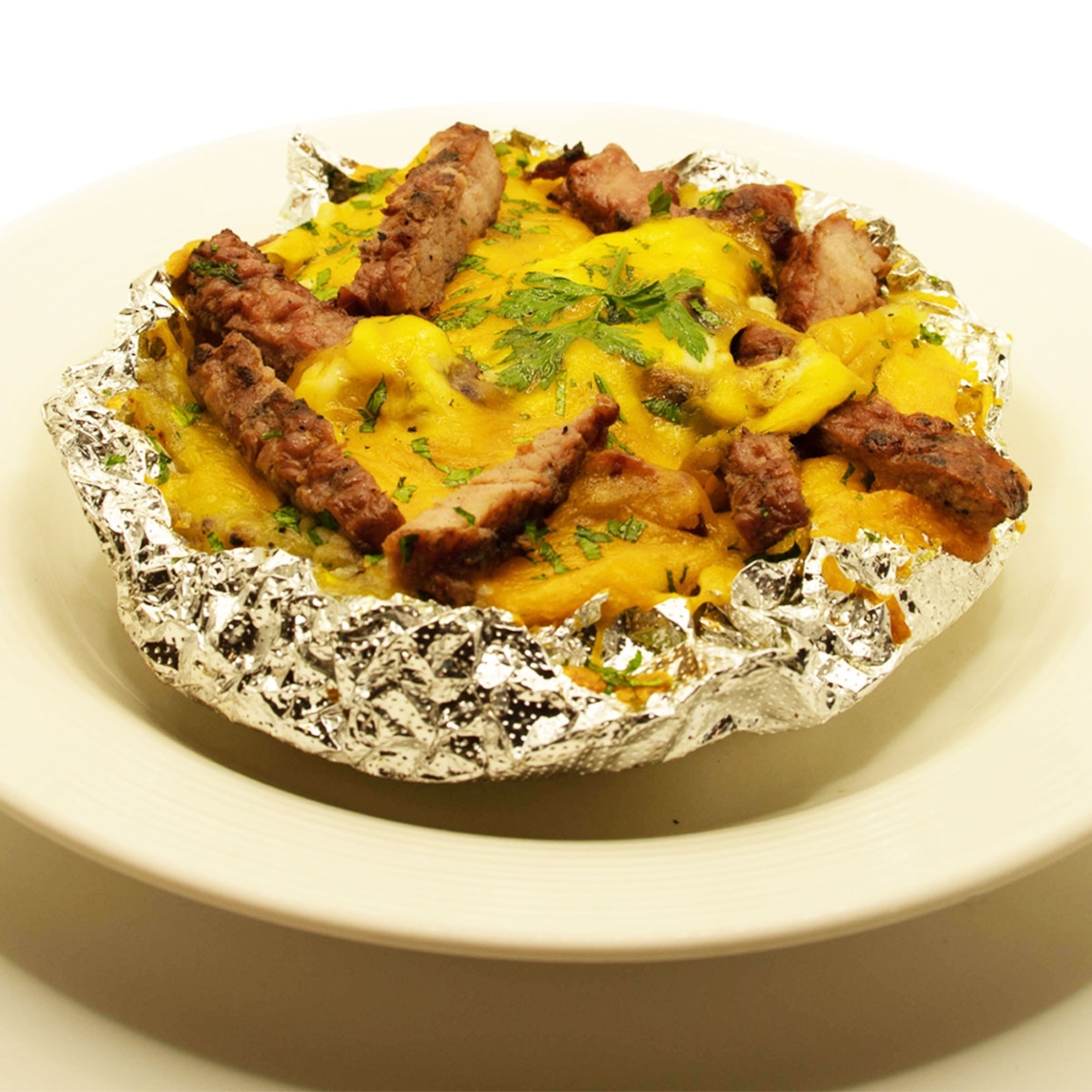 Papa asada con carne asada