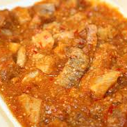 Toper de Chicharron con Papa en Salsa de Jitomate