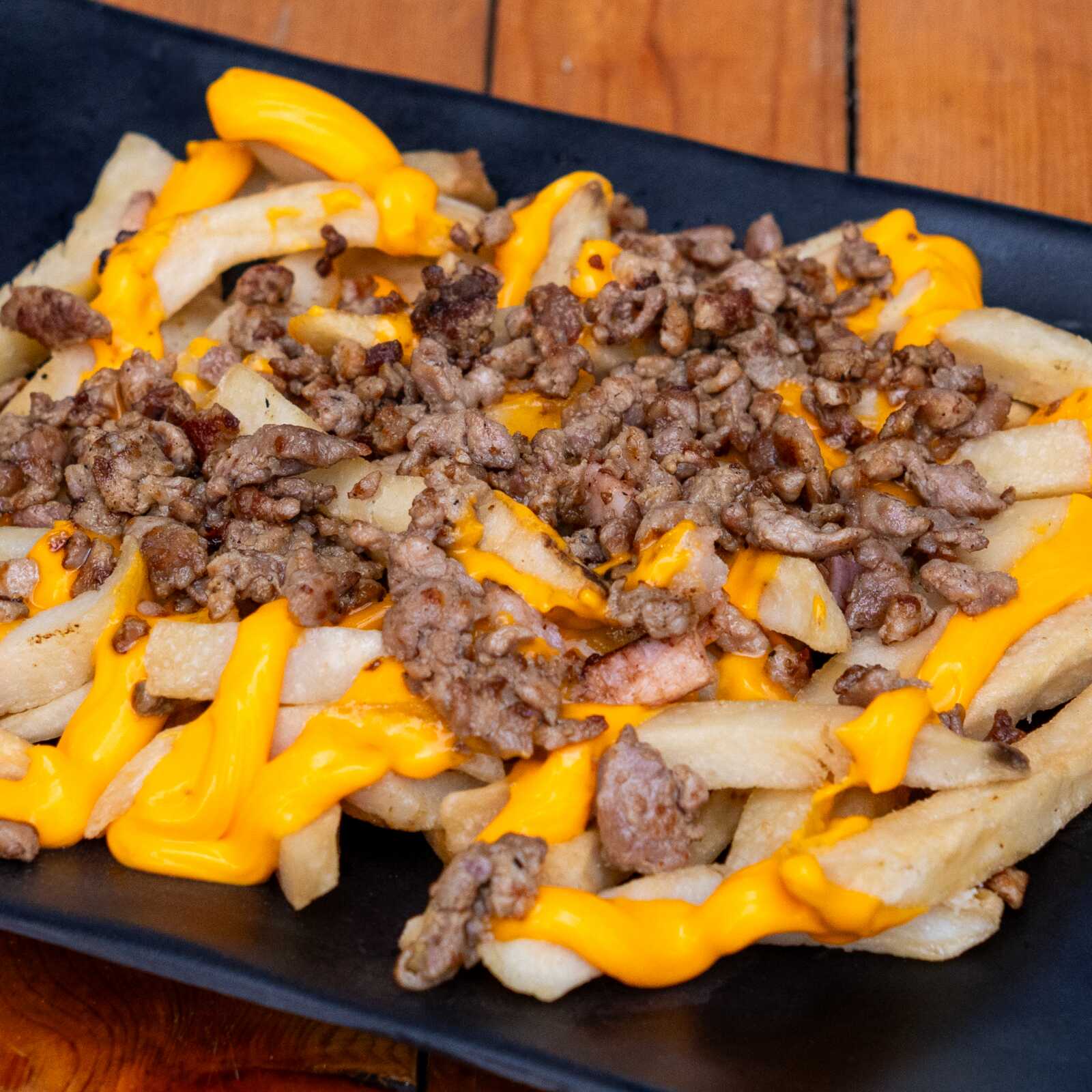 PAPAS FRITASc/queso y Bistec