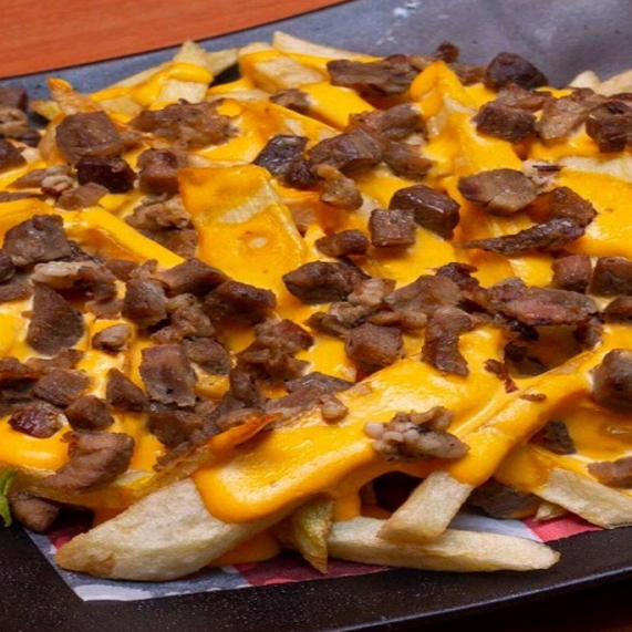Papas Fritas C/chedar y Trompo