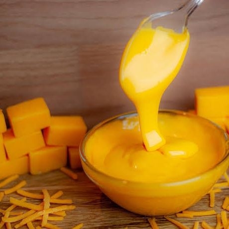 Extra Porción Queso Cheddar