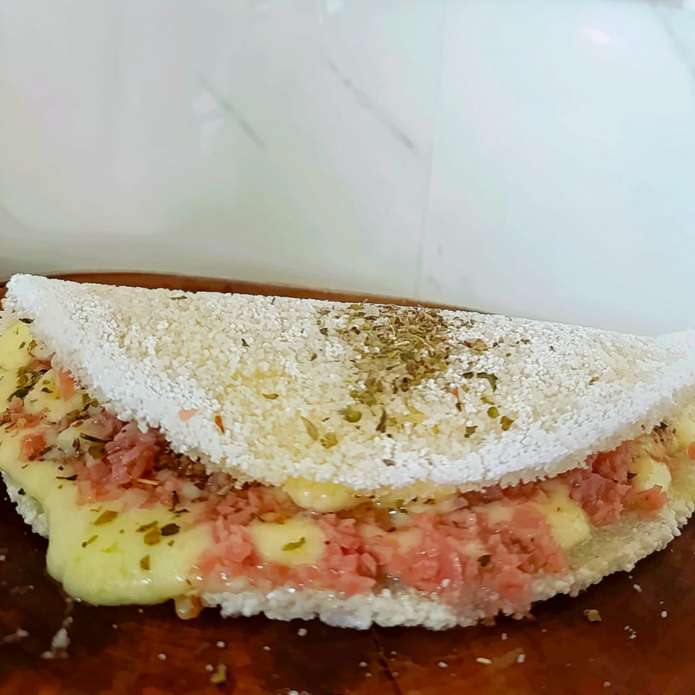 Tapioca sabor pizza queijo derretido, presunto e organo para aquele gostinho clássico e irresistível.