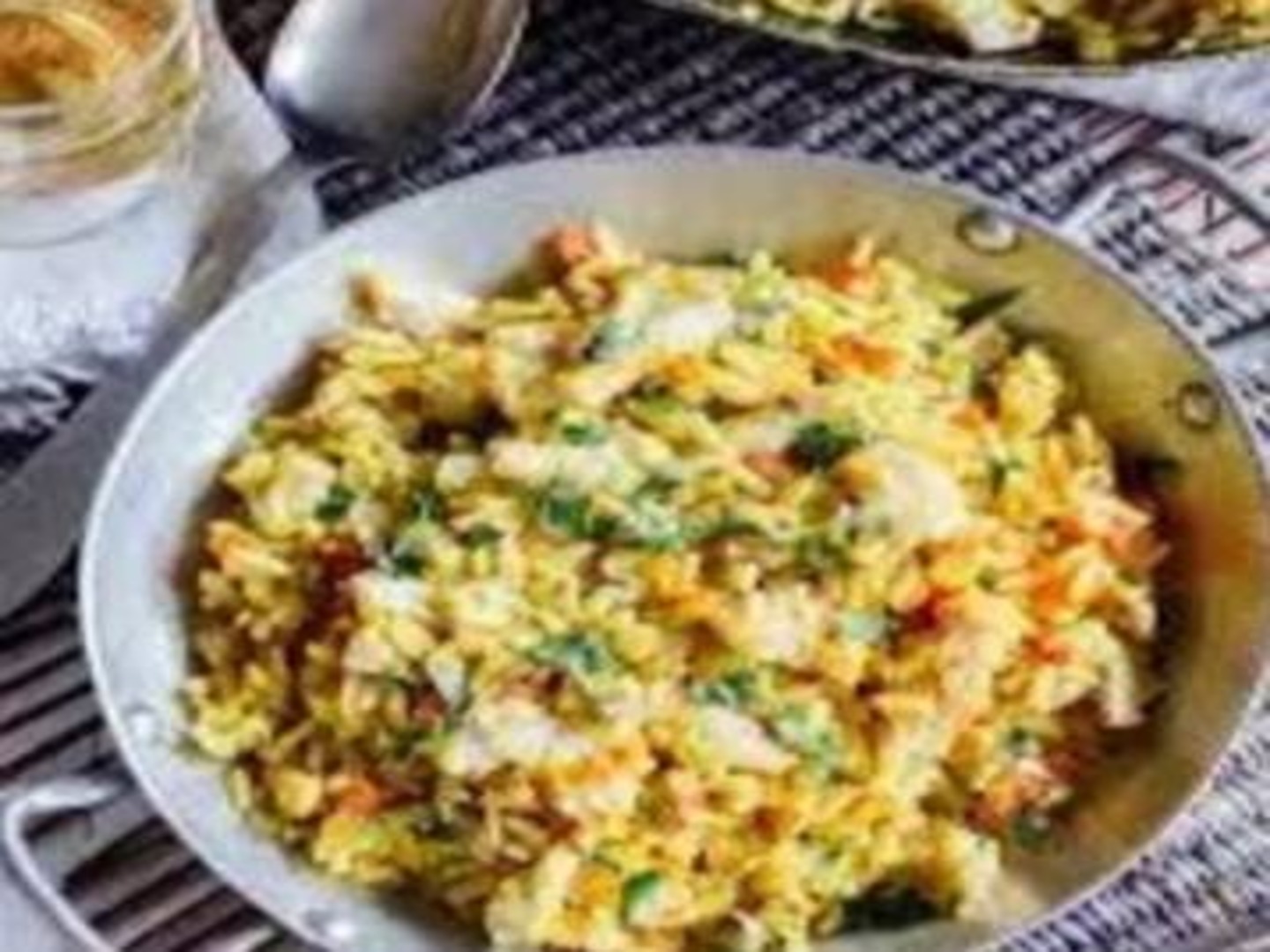 Arroz con Pescado entero.