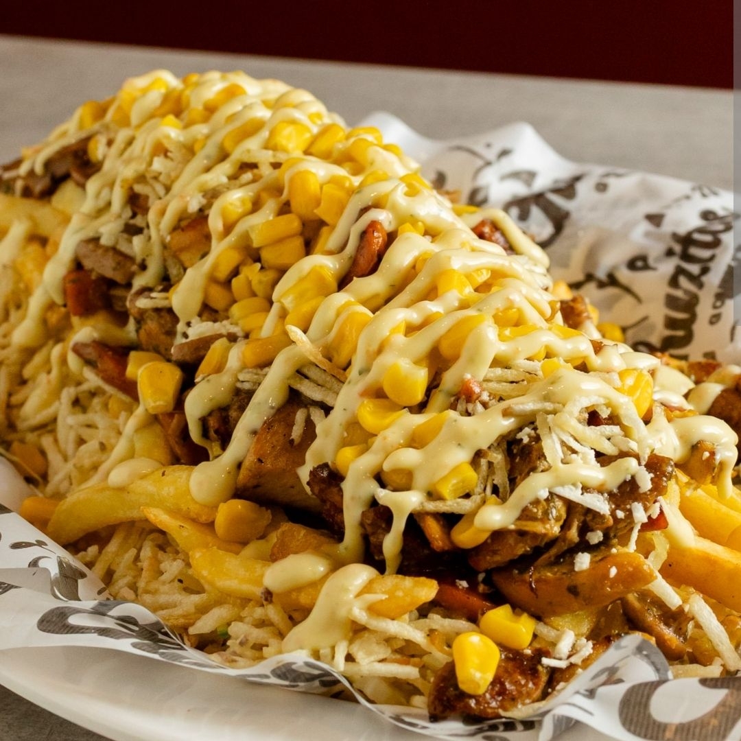 Chuzo de Carne Gratinado más Bebida