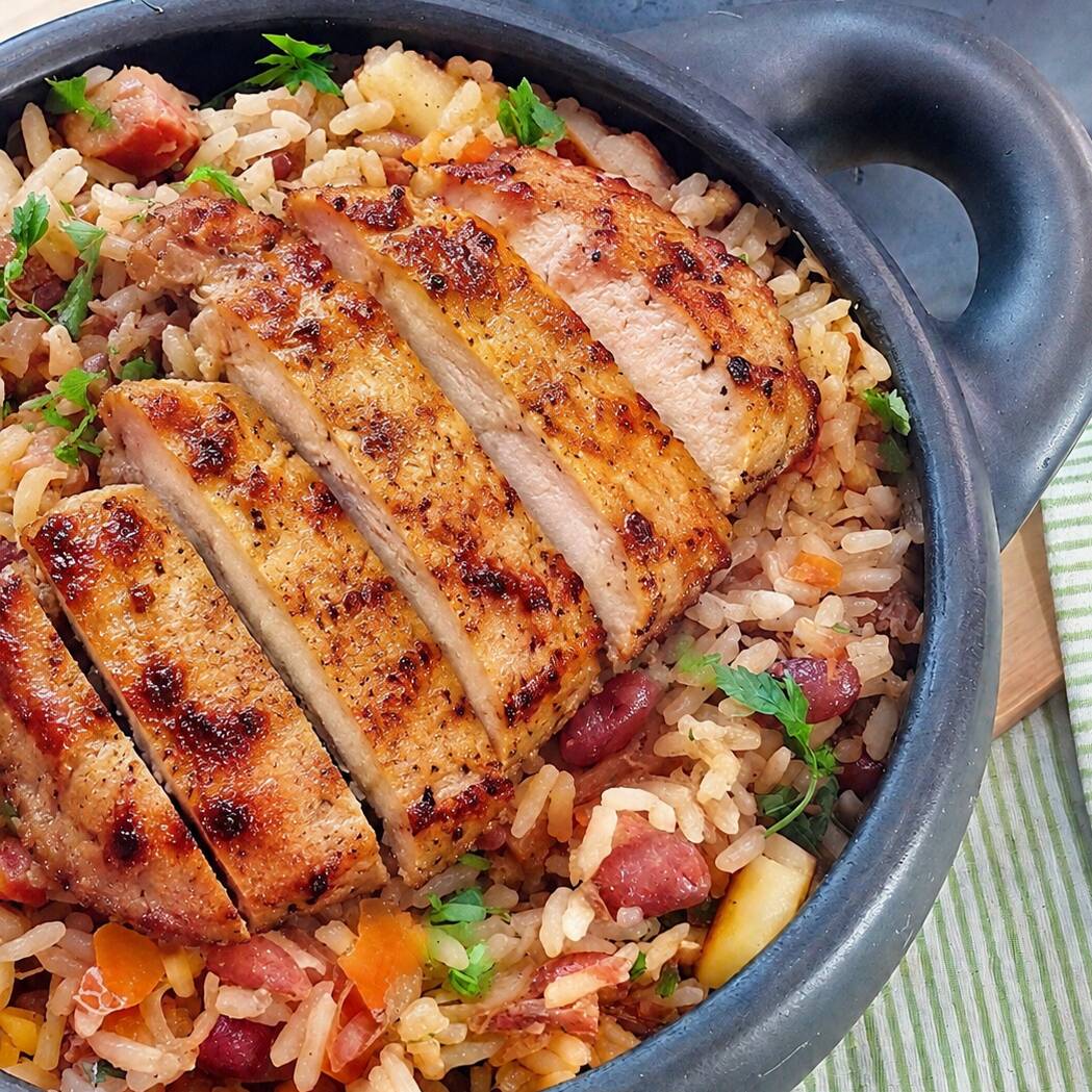 Delicioso baião de dois c/ bisteca suina grelhada.