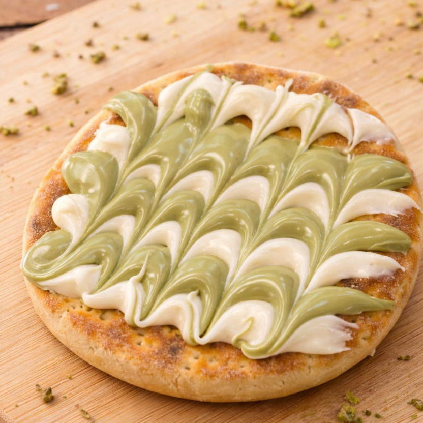 Feito com a nossa massa exclusiva com creme de pistache e creme de ninho