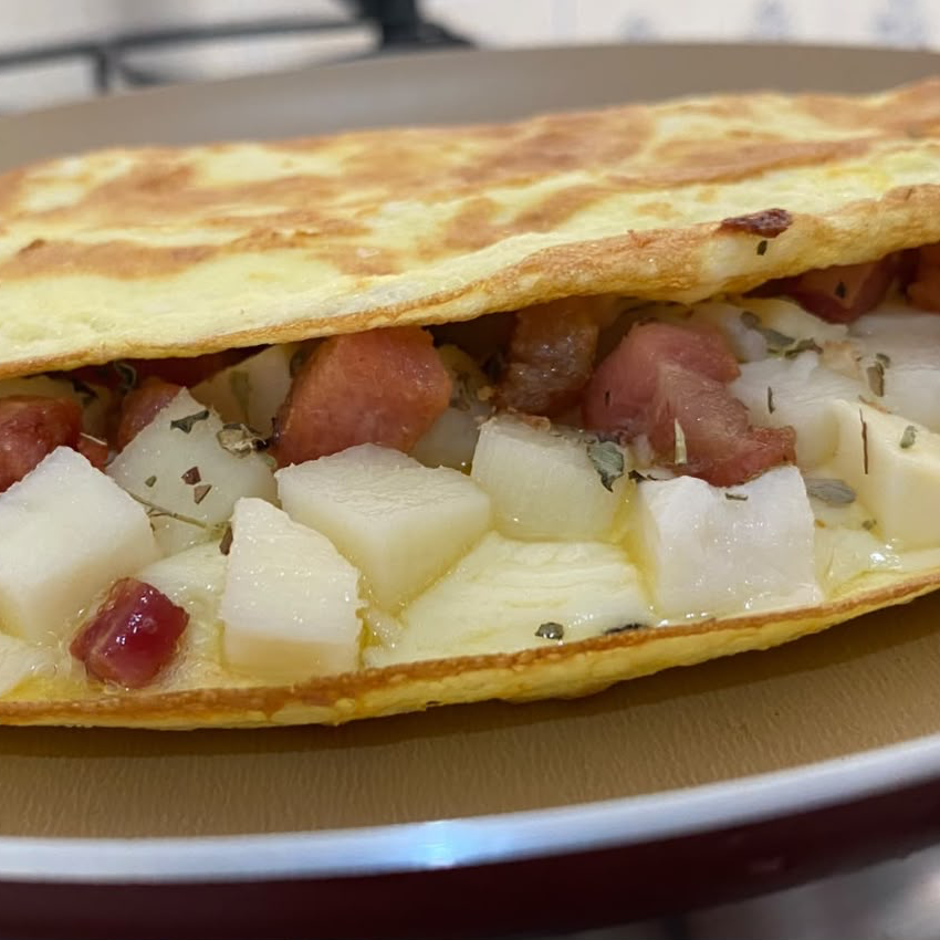 Palmito, mussarela, bacon e orégano.