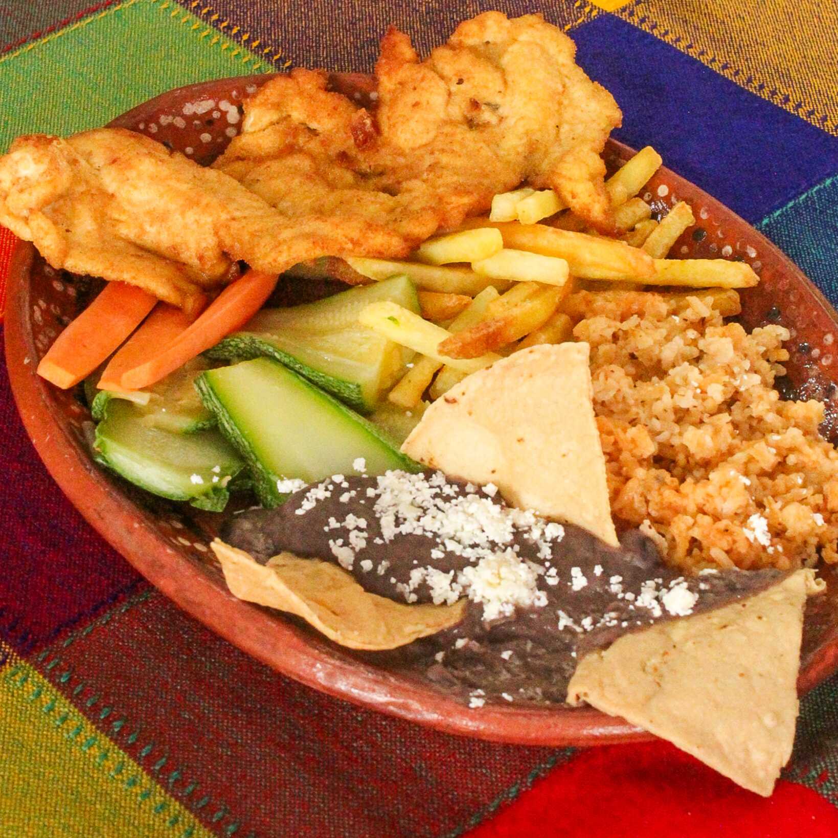 Milanesa de Pollo o Cerdo