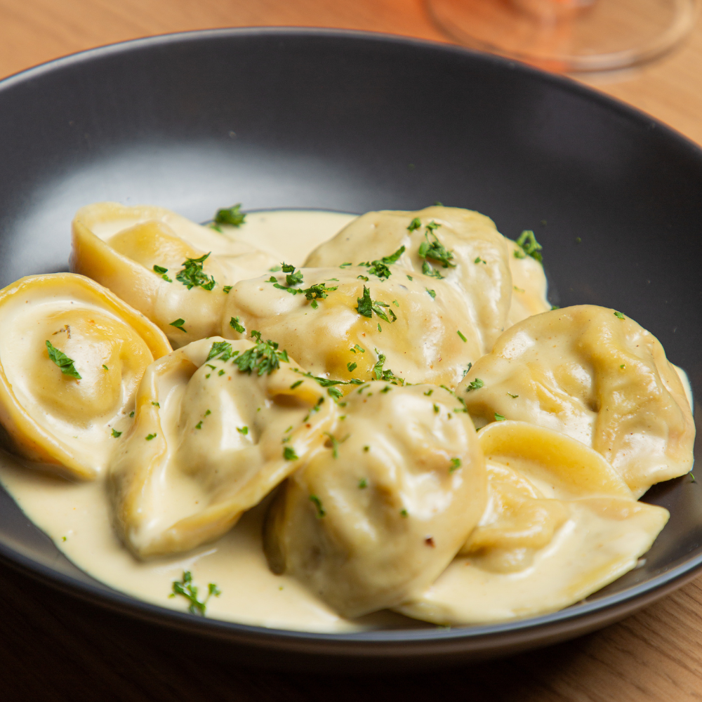 TORTELLONI DE RICOTA Y ESPINACA TRATORIA