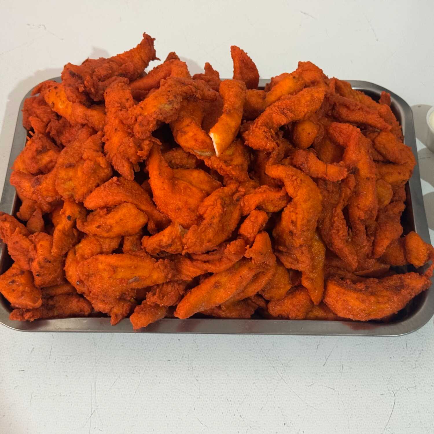1 Kg. de Tiras de Pechuga de Pollo Empanizada