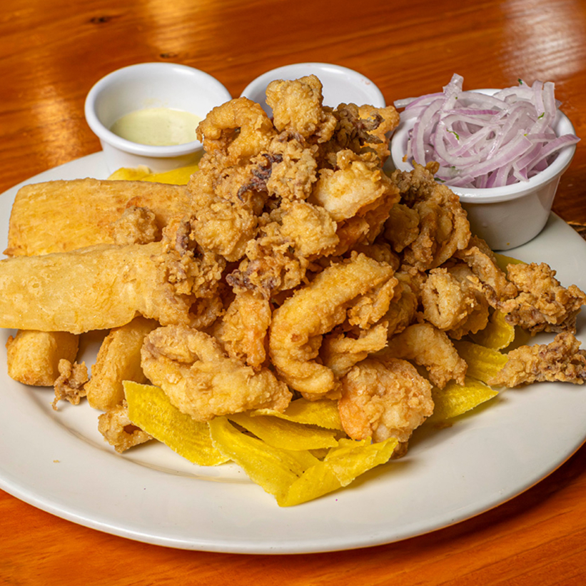 2Chicharron de Pota +Leche de Tigre+01 gaseosa