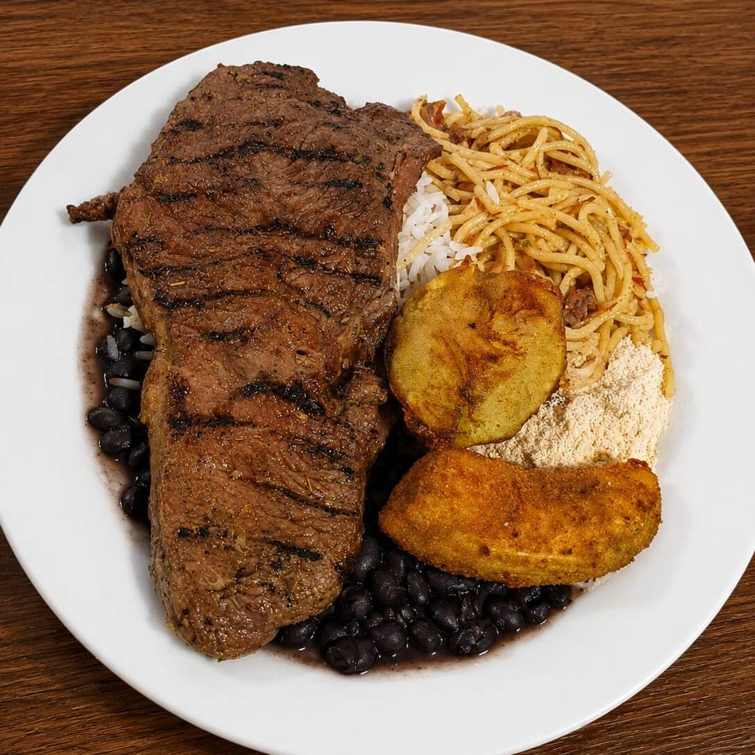 180g de Alcatra grelhada -Arroz -Feijão -Macarrão -Banana a milanesa -Batata rústica -Farofa