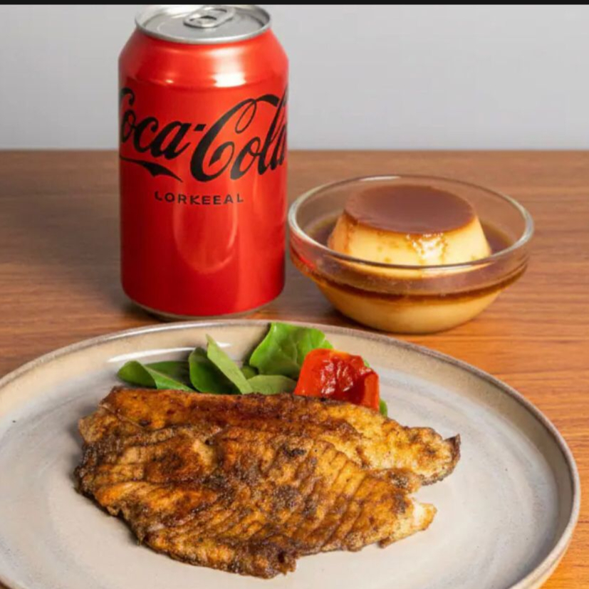 Filé de tilápia grelhado (150g, pesado in natura) com guarnições, bebida e sobremesa. A experiência mais completa para sua refeição. A proteína tem preparo delicado, dourado por fora e macio por dentro. Prato leve e saboroso. (Prato completo pesando aproximadamente 500g)