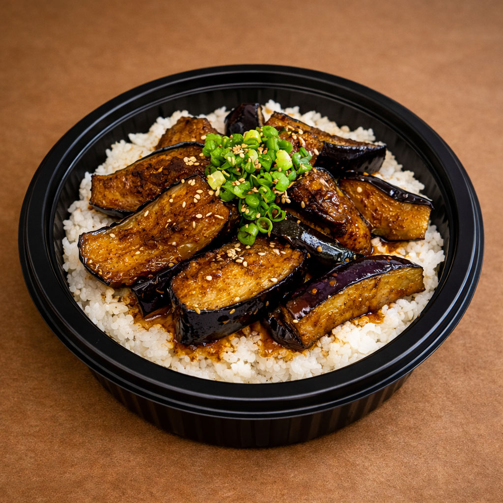 O prato consiste em berinjelas fritas e depois temperadas a base de alho, gengibre e molho especial. Depois vai sobre uma porção de arroz japonês (gohan) com cama de repolho.