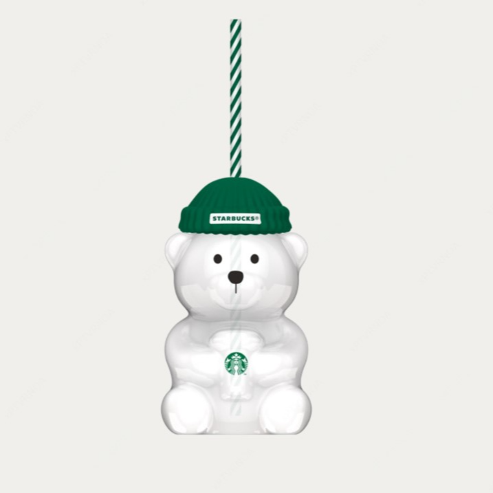 Copo de urso em vidro transparente e logotipo da Starbucks. Acabamento com chapéu verde de silicone com logotipo Starbucks em branco e verde, sobre uma tampa de rosca verde de aço inoxidável. Acabamento com canudo listrado verde e branco, para bebidas geladas - 591ml.
*produto não térmico*